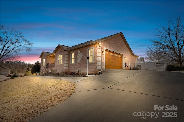 property exterior at dusk featuring a garage