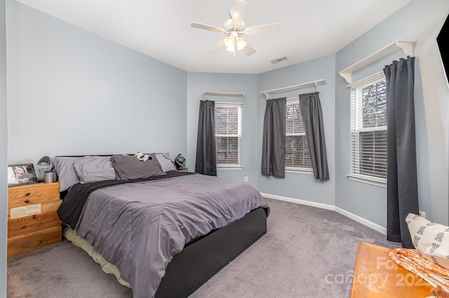 carpeted bedroom with ceiling fan