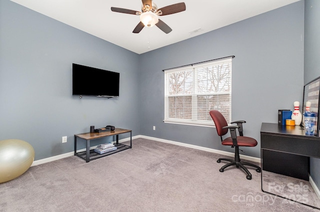 carpeted office with ceiling fan