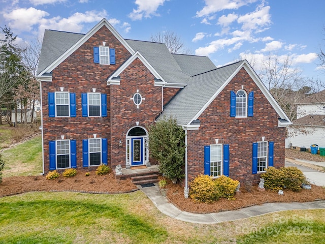 front facade with a front lawn