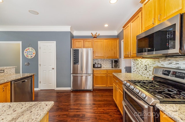 kitchen featuring dark wood-type flooring, backsplash, stainless steel appliances, light stone countertops, and ornamental molding