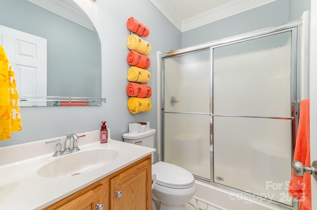 bathroom featuring ornamental molding, walk in shower, vanity, and toilet