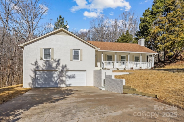 view of front of house with a garage and a porch