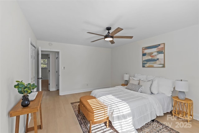 bedroom with ceiling fan and light wood-type flooring