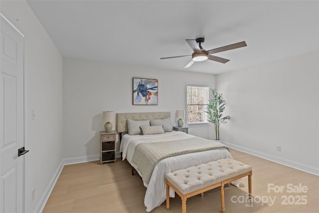 bedroom featuring ceiling fan and light hardwood / wood-style floors