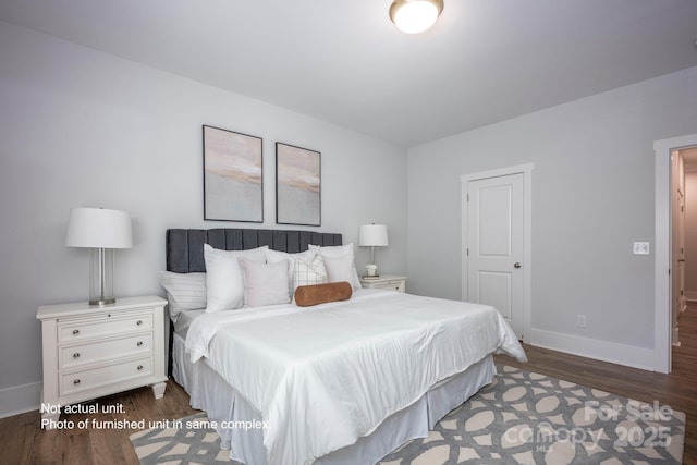 bedroom featuring dark hardwood / wood-style flooring