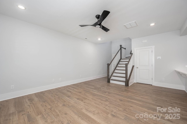 interior space with ceiling fan and wood-type flooring