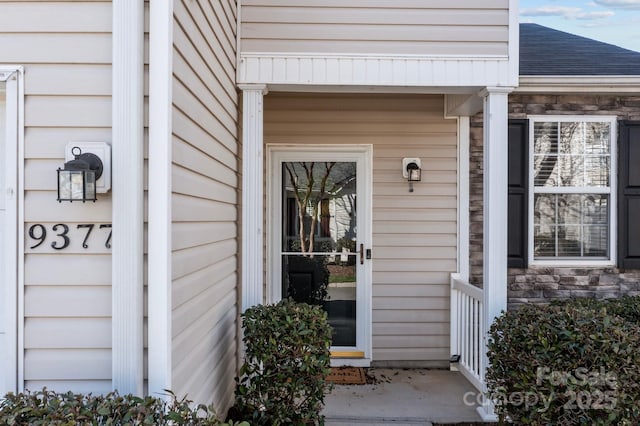 view of exterior entry with stone siding