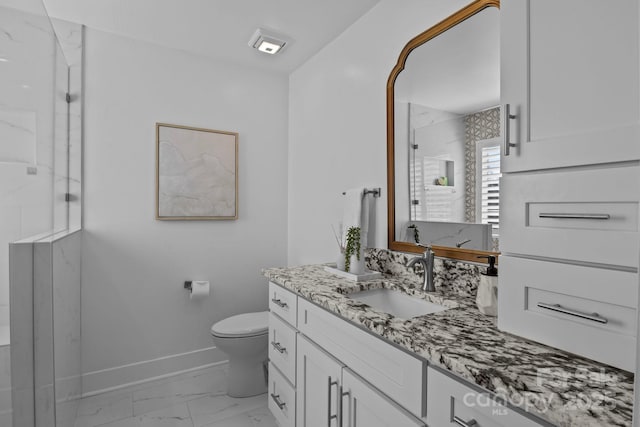 full bathroom featuring vanity, baseboards, a marble finish shower, toilet, and marble finish floor