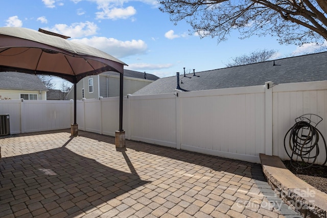 view of patio featuring a gazebo and a fenced backyard