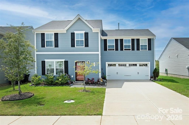 view of front facade featuring a garage and a front yard