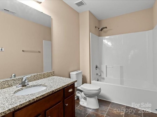 full bathroom featuring shower / bathing tub combination, vanity, and toilet