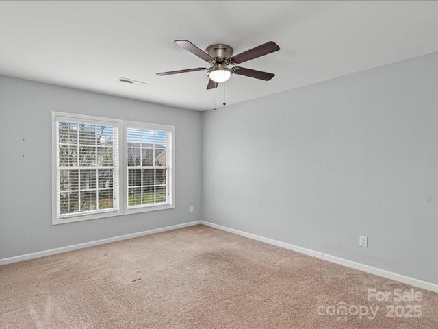 carpeted empty room with ceiling fan