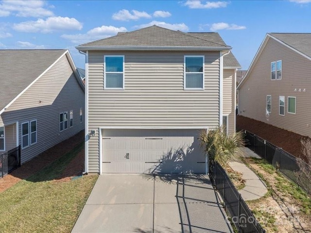 view of side of property featuring a garage and a yard