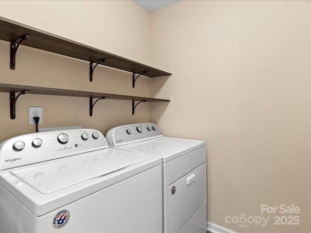 clothes washing area with washer and dryer