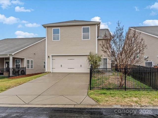 view of front of home featuring a garage and a front yard