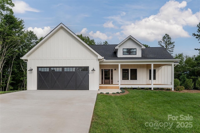 modern inspired farmhouse featuring a front lawn, driveway, a porch, board and batten siding, and a garage