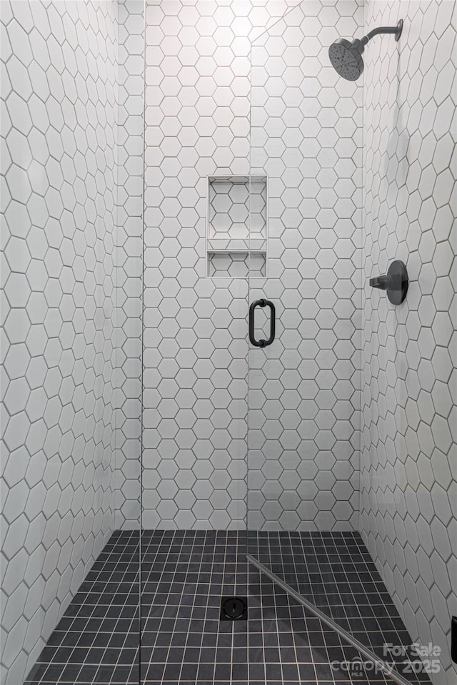 bathroom with a shower stall