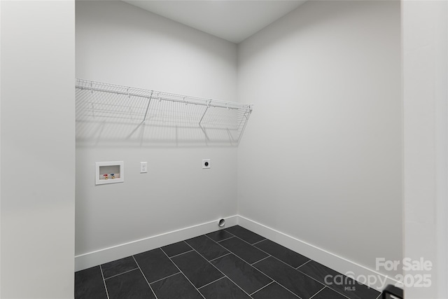 laundry room featuring hookup for a washing machine, baseboards, laundry area, dark tile patterned flooring, and electric dryer hookup