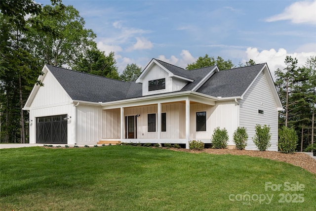 modern farmhouse style home with driveway, a porch, an attached garage, a front lawn, and board and batten siding