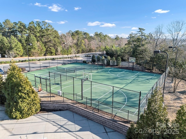 view of sport court featuring basketball hoop