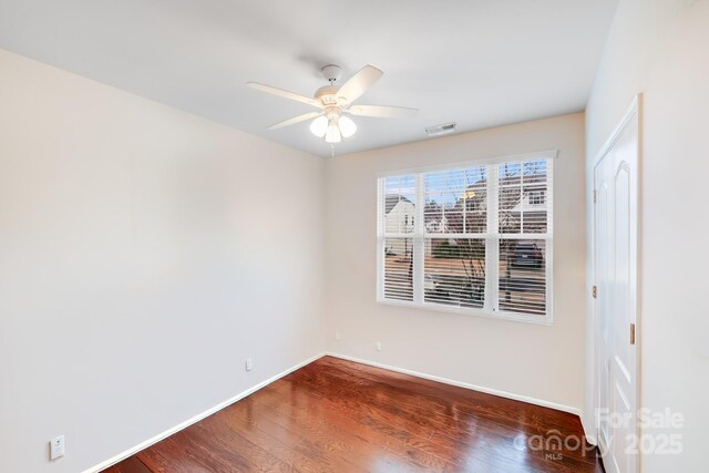 unfurnished room featuring ceiling fan and hardwood / wood-style floors