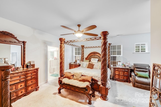 bedroom with connected bathroom, ceiling fan, and carpet flooring