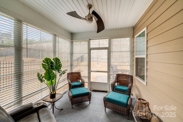 sunroom with ceiling fan and plenty of natural light