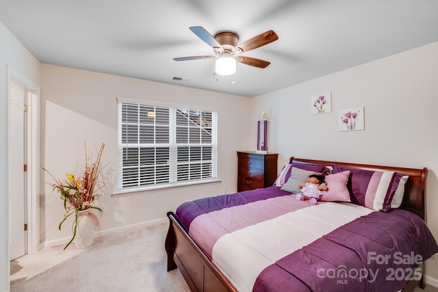 bedroom with light carpet and ceiling fan