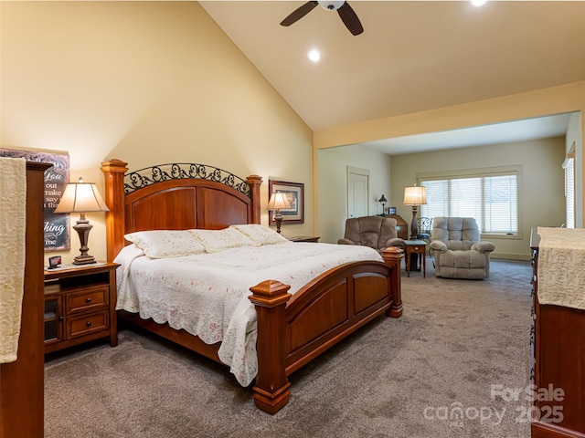 carpeted bedroom with ceiling fan and high vaulted ceiling