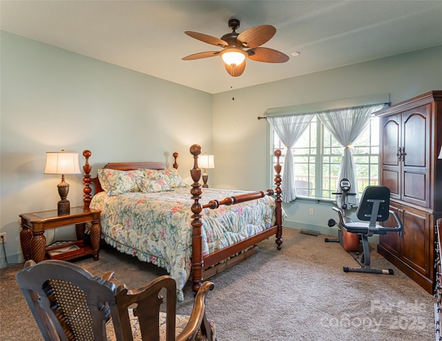 bedroom featuring ceiling fan and carpet