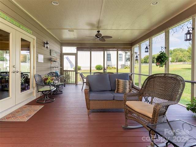 sunroom featuring french doors, ceiling fan, and a healthy amount of sunlight