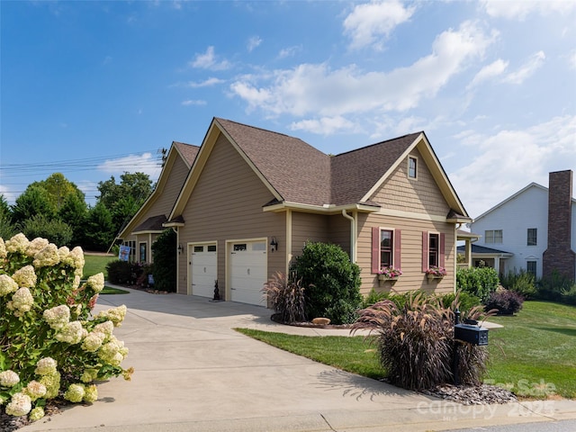 craftsman-style house with a garage and a front yard