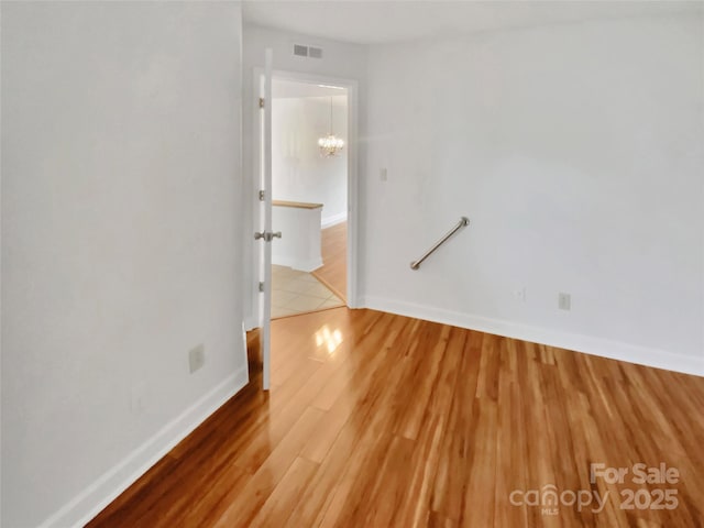 spare room featuring hardwood / wood-style floors