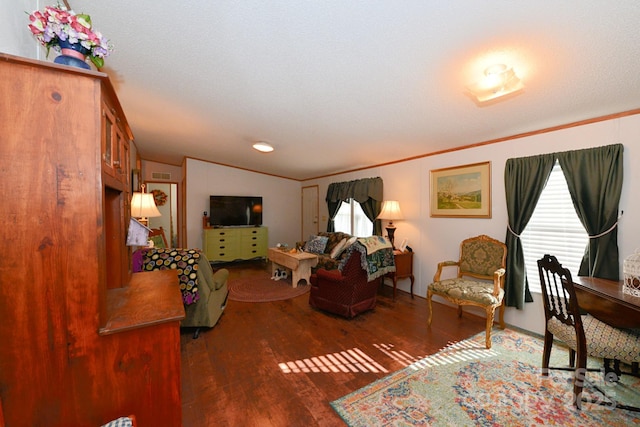 living room featuring dark wood-type flooring, crown molding, a textured ceiling, and lofted ceiling