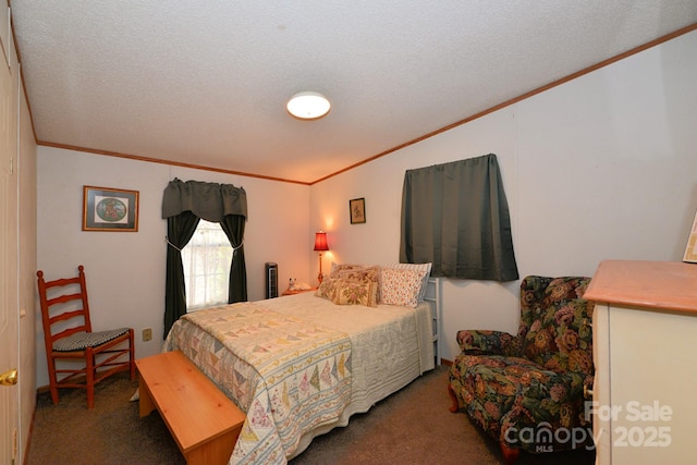 bedroom featuring carpet, ornamental molding, and a textured ceiling