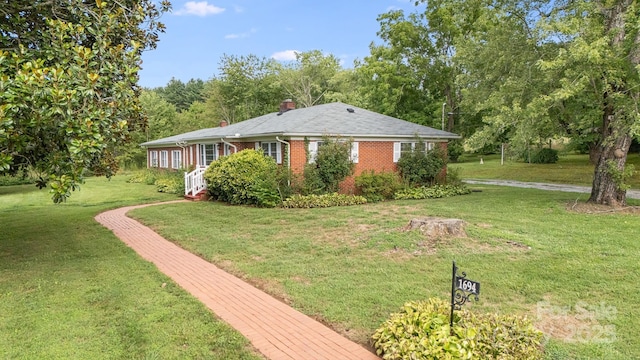 view of home's exterior with a lawn