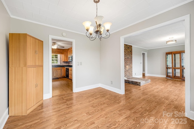 unfurnished dining area with light hardwood / wood-style flooring, ornamental molding, and a chandelier