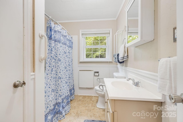 bathroom with vanity, radiator heating unit, ornamental molding, and toilet