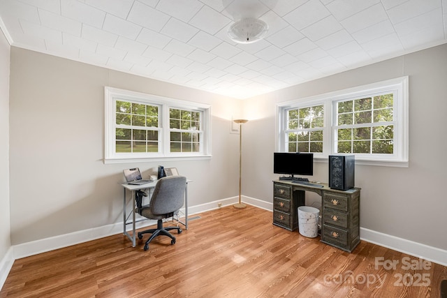 home office with light wood-type flooring