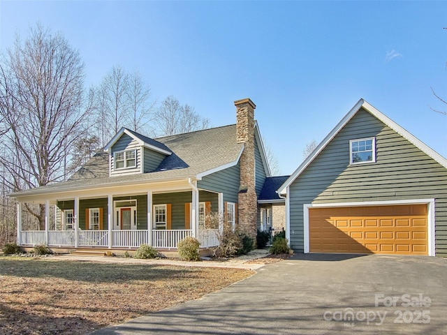 view of front of home with a garage and covered porch