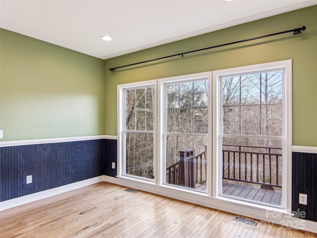 interior space featuring hardwood / wood-style flooring and plenty of natural light