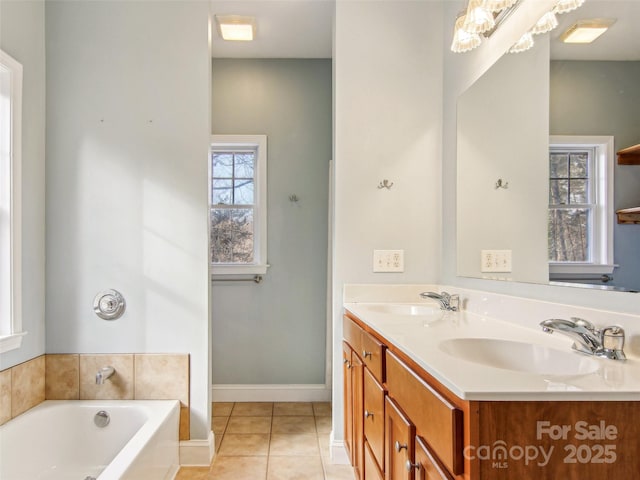 bathroom featuring vanity, a tub, and tile patterned floors