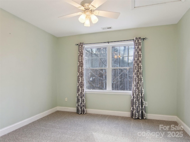 carpeted spare room with ceiling fan