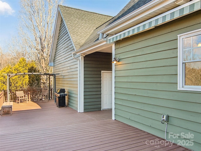 wooden terrace featuring area for grilling