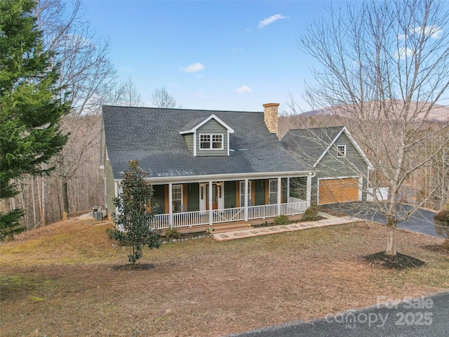 cape cod house featuring a porch, a garage, and cooling unit