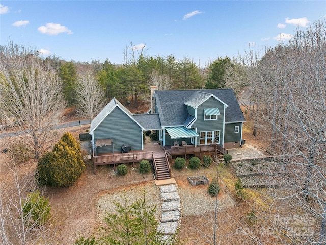 rear view of house with a deck