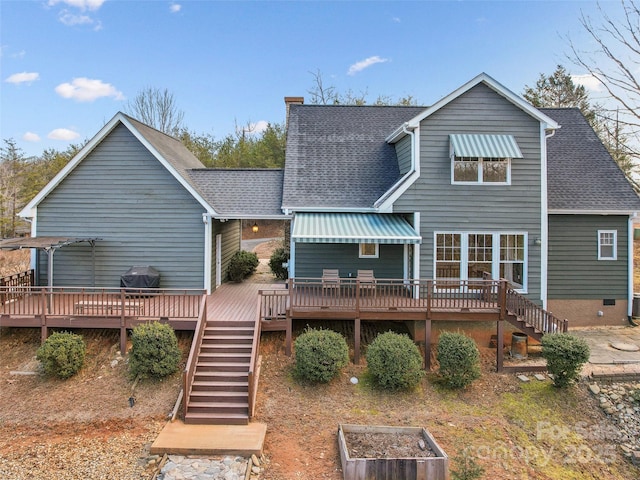 rear view of house featuring a deck