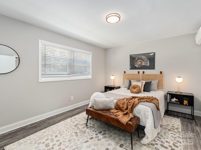 bedroom with dark hardwood / wood-style flooring