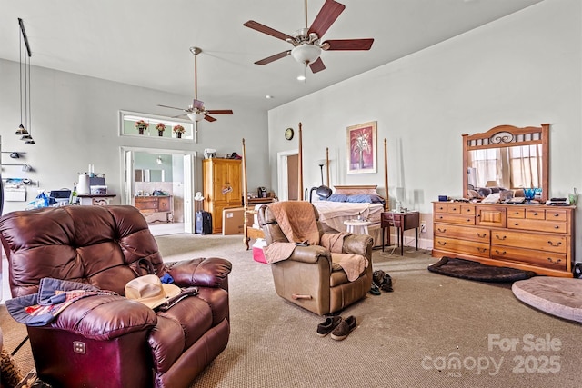 carpeted living room featuring a towering ceiling and ceiling fan